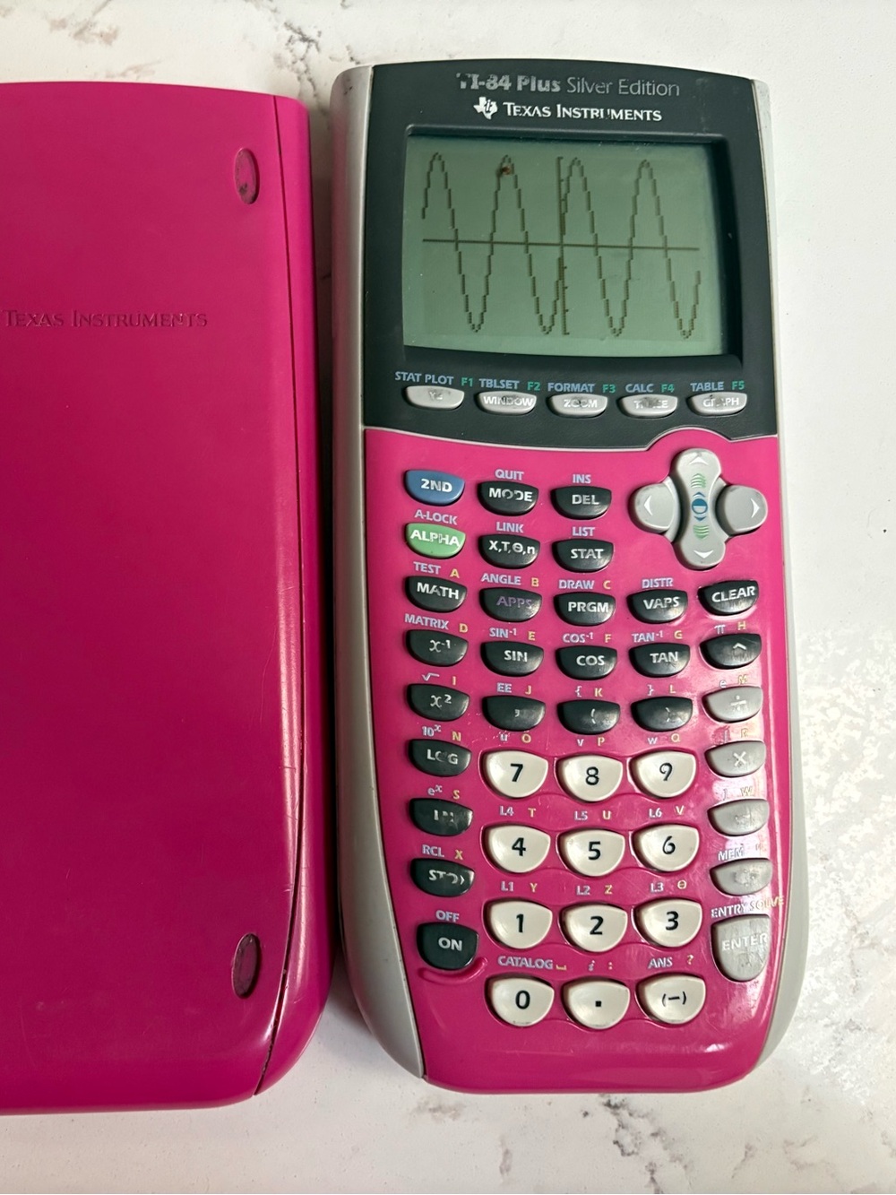 Texas Instruments Pink TI-84 Plus Silver Edition Graphing Calculator